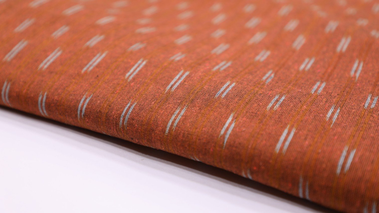 BURNING SAND RUST ORANGE COLOR COTTON IKAT TWO TONE TEXTURE GEOMETRIC WEAVE MOTIF FABRIC - 4104