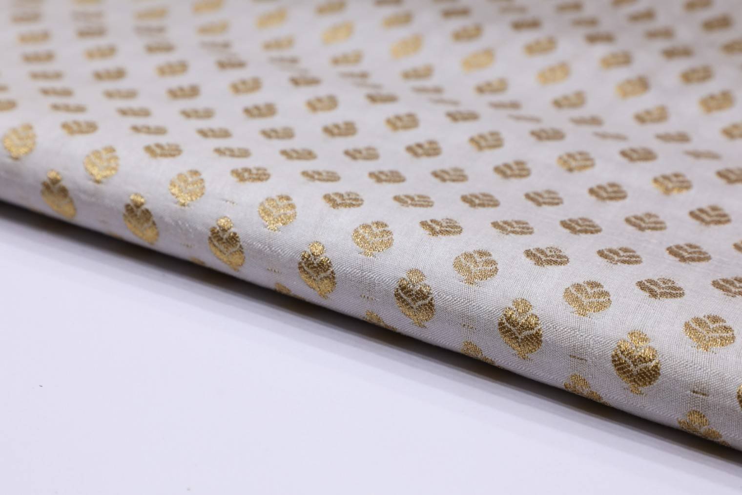 DIABLE CREAM COLOR BANARASI CHANDERI METALIC ANMOL GOLD LEHERIYA PATTERN PORY BROCADE FABRIC 11123