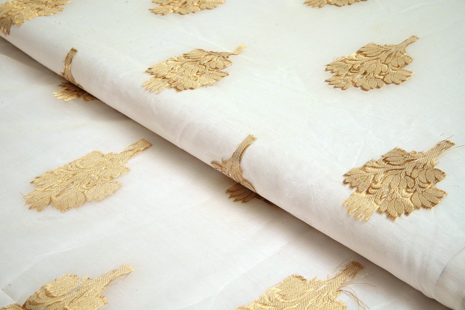 DIABLE CREAM COLOR BANARASI CHANDERI METALIC ANMOL GOLD LEHERIYA PATTERN PORY BROCADE FABRIC 11123